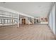 Spacious finished basement with laminate floors, recessed lighting, and mirrored wall at 8280 Queen St, Arvada, CO 80005