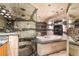 Luxurious bathroom featuring a bathtub, a glass shower, and a fireplace at 8280 Queen St, Arvada, CO 80005