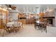 Open concept kitchen with central island, stainless steel appliances, and adjacent dining areas at 8280 Queen St, Arvada, CO 80005