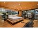 Unique bedroom featuring a river design in the floor, a platform bed, and a stone fireplace with Om symbols at 8280 Queen St, Arvada, CO 80005