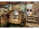 Unique spa area with stone design features and a water feature that has Om symbols on stone pillars at 8280 Queen St, Arvada, CO 80005