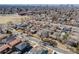 An aerial view of a neighborhood with city skyline in the distance at 2645 Jasmine St, Denver, CO 80207