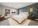 Bedroom featuring accent wall with floral wallpaper, a cozy chair and a large window at 2645 Jasmine St, Denver, CO 80207