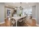 Modern dining room with stylish lighting, a zebra print rug, and an open layout at 2645 Jasmine St, Denver, CO 80207