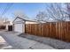 Detached two car garage featuring new construction, privacy fence and alley access at 2645 Jasmine St, Denver, CO 80207