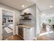 Hallway featuring a bar area with wine storage and access to the bedroom and living room at 2645 Jasmine St, Denver, CO 80207