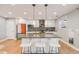 Bright kitchen featuring a large center island, modern appliances, and stylish pendant lighting at 2645 Jasmine St, Denver, CO 80207