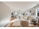 Spacious living room showcasing an elegant fireplace, hardwood floors and an open concept layout at 2645 Jasmine St, Denver, CO 80207