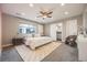 Main bedroom with ensuite bathroom and a ceiling fan that provides a comfortable living space at 2645 Jasmine St, Denver, CO 80207