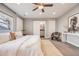 Main bedroom with ensuite bathroom, ceiling fan, and sliding door at 2645 Jasmine St, Denver, CO 80207