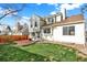 Spacious backyard with lush green lawn, privacy fence, brick patio perfect for outdoor entertaining and relaxation at 2246 Mountain Sage Dr, Highlands Ranch, CO 80126
