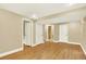Open basement area with wood-look floors, three doors, and recessed lighting at 2246 Mountain Sage Dr, Highlands Ranch, CO 80126