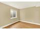 Unfinished basement with wood-look flooring, neutral walls, and a window at 2246 Mountain Sage Dr, Highlands Ranch, CO 80126