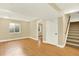 Spacious basement area with wood-look flooring, stairs, and a neutral color scheme at 2246 Mountain Sage Dr, Highlands Ranch, CO 80126