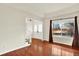 Bright living room features hardwood floors, large windows, and a staircase leading to the upper level at 2246 Mountain Sage Dr, Highlands Ranch, CO 80126