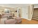Inviting living room with modern decor, light wood floors, and comfortable seating at 2246 Mountain Sage Dr, Highlands Ranch, CO 80126