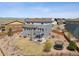 Aerial view of home and backyard with a stone patio, gas firepit, trampoline, and fenced yard at 11426 Box Turtle Ct, Parker, CO 80134