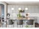 A modern kitchen with stainless steel appliances and a large island with seating at 11426 Box Turtle Ct, Parker, CO 80134