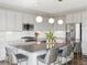 A modern kitchen with stainless steel appliances and a large island with seating at 11426 Box Turtle Ct, Parker, CO 80134