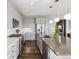 Stylish kitchen boasts stainless steel appliances, ample counter space, and modern lighting at 11426 Box Turtle Ct, Parker, CO 80134