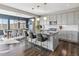 Open-concept kitchen and dining area with modern appliances and seamless flow at 11426 Box Turtle Ct, Parker, CO 80134
