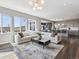 Bright, open-concept living area with hardwood floors and large windows offer scenic views at 11426 Box Turtle Ct, Parker, CO 80134
