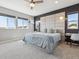 Relaxing main bedroom featuring a modern bed with a padded headboard, side tables, and natural light at 11426 Box Turtle Ct, Parker, CO 80134