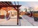Inviting backyard with a pergola, firepit, patio, and garden, designed for relaxation and entertaining guests at 3130 S Krameria St, Denver, CO 80222