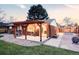 Inviting backyard with a pergola, hammock swings, patio and a fire pit perfect for outdoor living and entertaining at 3130 S Krameria St, Denver, CO 80222