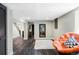 Finished basement sitting area with wood floors and a comfortable papasan chair at 3130 S Krameria St, Denver, CO 80222