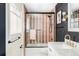 Updated bathroom with modern fixtures, tiled shower, and elegant vanity at 3130 S Krameria St, Denver, CO 80222
