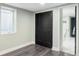 Bedroom features black closet doors and an adjoining bathroom at 3130 S Krameria St, Denver, CO 80222