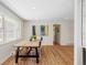 Well-lit dining room with a rustic table, bright windows, and minimalist decor at 3130 S Krameria St, Denver, CO 80222