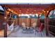 Charming outdoor firepit area with Adirondack chairs, string lights and a hammock at 3130 S Krameria St, Denver, CO 80222
