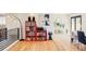 Open living space with hardwood floors, a unique bookshelf, and modern decor throughout at 3130 S Krameria St, Denver, CO 80222
