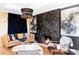Inviting living room featuring a stylish fireplace, modern lighting, comfortable seating, and elegant artwork at 3130 S Krameria St, Denver, CO 80222