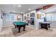 Finished basement area with a pool table and air hockey, perfect for entertainment and recreation at 10046 Brisbane Ln, Highlands Ranch, CO 80130