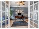 Home office with stylish decor, modern lighting, and an ergonomic workspace at 10046 Brisbane Ln, Highlands Ranch, CO 80130