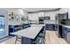 Stylish kitchen featuring custom cabinets, stainless appliances, and large center island at 10046 Brisbane Ln, Highlands Ranch, CO 80130