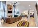 Open concept living space with hardwood floors, a fireplace, and an open kitchen at 10046 Brisbane Ln, Highlands Ranch, CO 80130