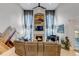 Spacious living room featuring a fireplace, piano, and vaulted ceilings at 10046 Brisbane Ln, Highlands Ranch, CO 80130