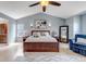 Spacious bedroom featuring vaulted ceiling, ceiling fan, and natural light from the windows at 10046 Brisbane Ln, Highlands Ranch, CO 80130