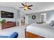 Bright primary bedroom featuring hardwood floors, sitting area, stylish decor, and lots of natural light at 10046 Brisbane Ln, Highlands Ranch, CO 80130