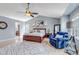 Spacious main bedroom with vaulted ceiling, hardwood floors, large rug, and blue sitting chair at 10046 Brisbane Ln, Highlands Ranch, CO 80130