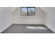 Inviting attic room showcasing a window with natural light and modern design at 1601 Robb St, Lakewood, CO 80215