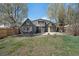 Charming backyard featuring a well-maintained lawn and stylish home exterior at 1601 Robb St, Lakewood, CO 80215