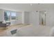 Bright bedroom with a cozy chair and direct access to the outdoors at 1601 Robb St, Lakewood, CO 80215