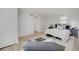 Spacious bedroom with fluffy rug, white walls, and a comfortable bed at 1601 Robb St, Lakewood, CO 80215