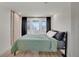 Inviting bedroom with direct deck access and contemporary design elements at 1601 Robb St, Lakewood, CO 80215