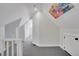 Bright hallway with crisp white walls and trim, leading to other rooms in the house at 1601 Robb St, Lakewood, CO 80215